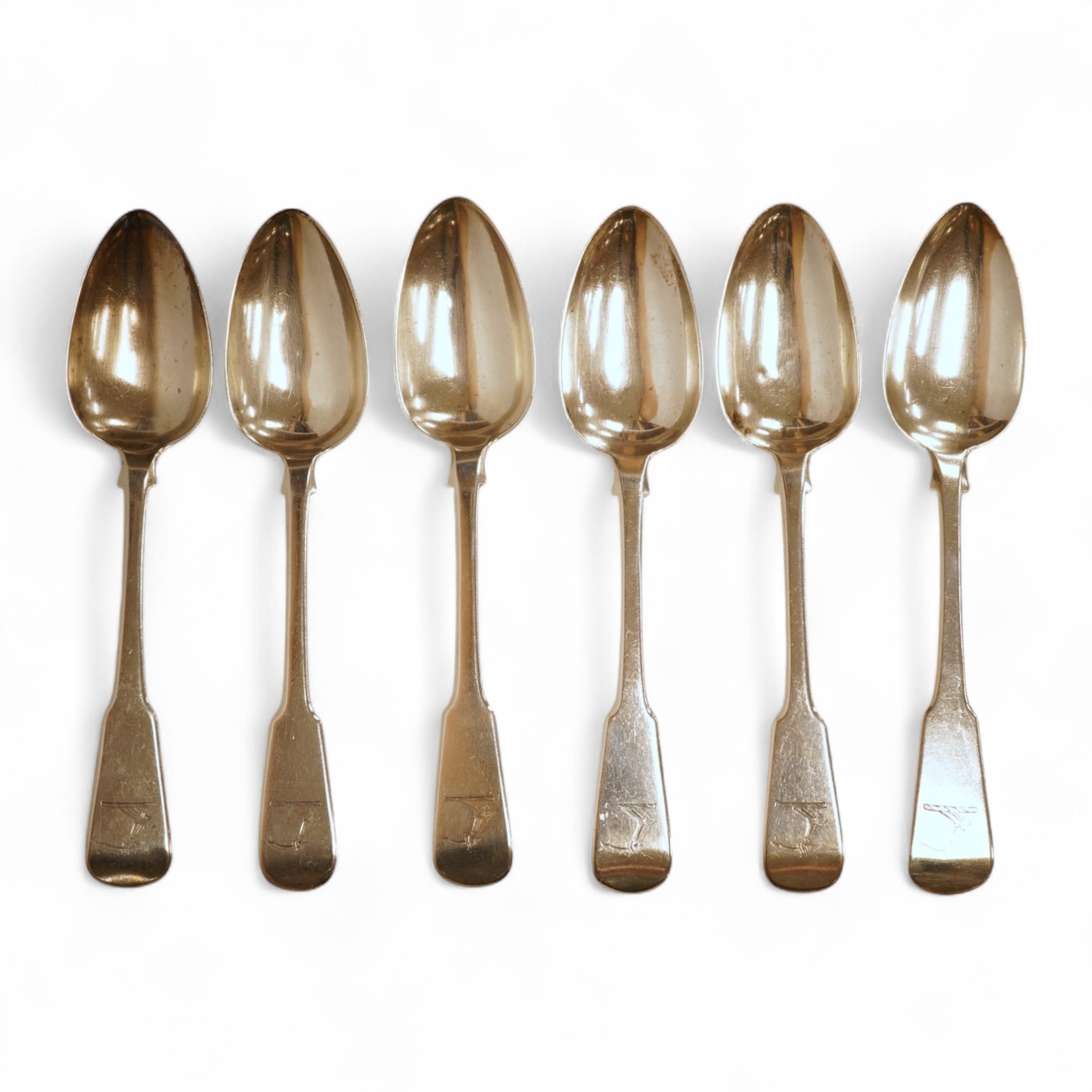 A matched set of six George III silver fiddle pattern table spoons, including four by Eley, Fearn and Chawner, London, 1820 and two London, 1808, 14.2oz.